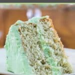 A slice of homemade pistachio cake on a plate.