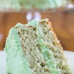 A slice of pistachio cake on a plate.