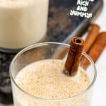 Homemade spiked eggnog and cinnamon sticks.