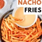 Homemade taco bell nacho fries and cheese dipping sauce on a plate.