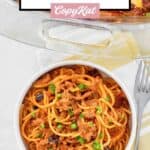 Cheesy taco spaghetti casserole serving in a bowl.