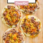 Homemade taco villa mexican pizza things scattered on a wood serving board.