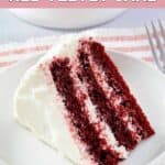 A slice of homemade waldorf astoria red velvet cake on a small plate.