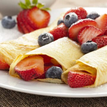 Berry crepes on a plate.