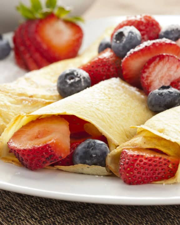 Berry crepes on a plate.