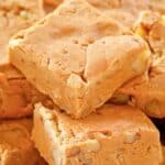 Pieces of homemade buttermilk fudge piled on a plate.