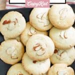 Homemade Chinese almond cookies piled on a square platter.