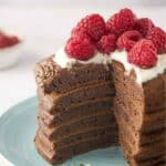 Chocolate pancakes in a stack and a wedge cut out of it.