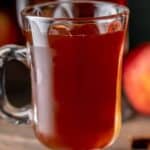 A mug of homemade wassail that was made in a crockpot.
