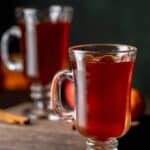 A mug of homemade wassail on a table.