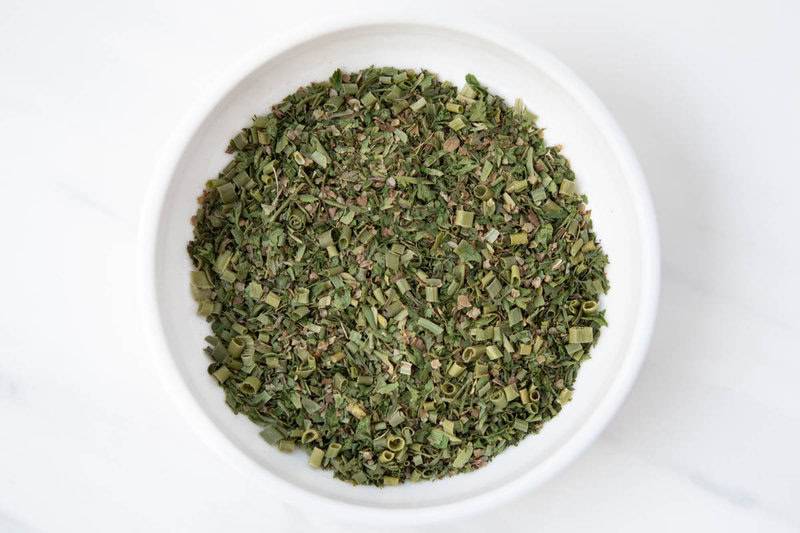 Homemade fine herbes blend in a bowl.