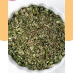 Homemade fines herbes with dried spices in a small bowl.