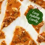 Homemade old fashioned pecan brittle on parchment paper.