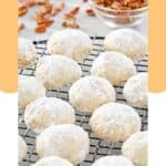 Homemade pecan sandies cookies on a wire rack.