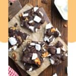 Homemade rocky road candy with walnuts on parchment paper.