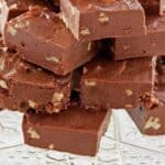 Homemade See's fudge on a glass stand.