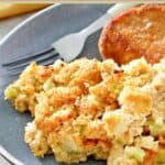 Southern cornbread dressing and a fork on a plate.