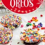 Decorated white chocolate covered oreos on parchment paper.