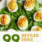 Deviled eggs and spinach leaves on a plate.