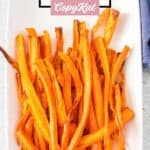 Air fried carrot sticks on a platter.