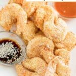 Air fryer shrimp tempura and small cups of dipping sauces on a platter.