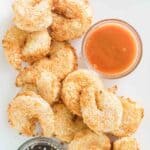 Air fryer shrimp tempura and two dipping sauces on a platter.
