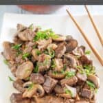Homemade Benihana steak and chopsticks on a platter.