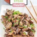 Homemade Benihana steak with mushrooms and a bowl of steamed rice.