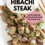 Homemade Benihana hibachi steak and mushrooms on a rectangular plate.