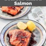Homemade Cheddar's bourbon glazed salmon and lemon slices on two plates.