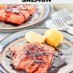 Homemade Cheddar's grilled salmon with bourbon glaze and lemon slices on a plate.