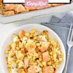 Homemade chicken and dressing casserole in a bowl and a fork next to it.