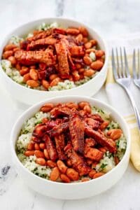 Copycat Chipotle smoked brisket over rice in two bowl.