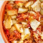 A bowl of crockpot cheesy potatoes.
