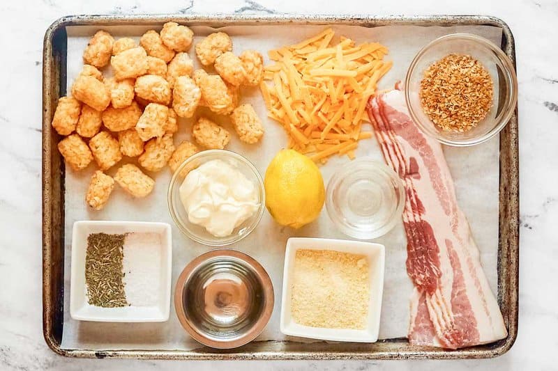 Copycat Domino's cheddar bacon loaded tots ingredients on a tray.