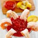 Homemade cocktail sauce served with shrimp in a martini glass.