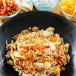 A bowl of salsa chicken made in an Instant Pot.
