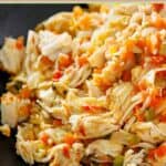 Shredded Instant pot salsa chicken in a bowl.