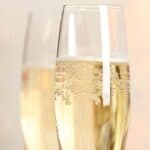 Two flute glasses with mock champagne drink.