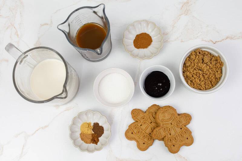 Copycat Starbucks iced gingerbread oat milk chai latte ingredients on a marble surface.