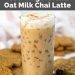 Homemade Starbucks iced gingerbread oat milk chai latte and cookies behind it.