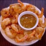Copycat Joe's Crab Shack dipping sauce and fried shrimp around it.