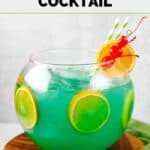 Homemade Bennigan's paddy o' punch cocktail in a small fishbowl.
