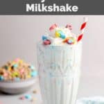 Copycat Burger King lucky charms milkshake and a small bowl of the cereal behind it.