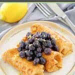 Homemade cheese blintzes with blueberry topping.