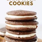 A stack of four homemade chocolate sandwich cookies.
