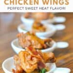 Homemade honey habanero chicken wings topped with bacon.