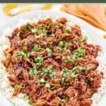 Instant pot pulled pork on an oval platter.
