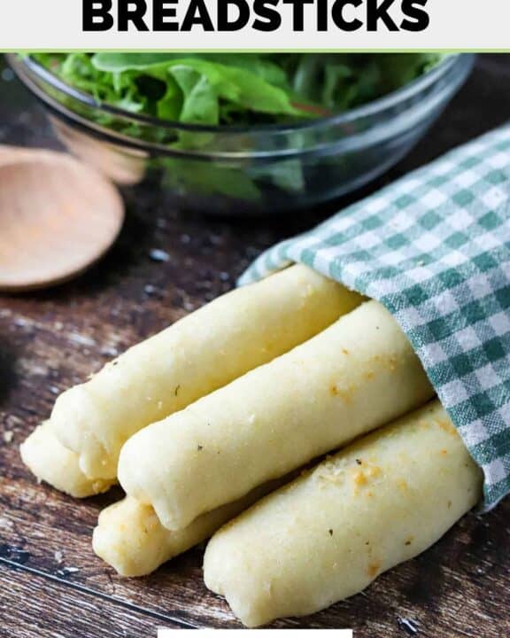 Homemade Olive Garden breadsticks and a green salad.
