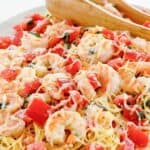 Homemade Olive Garden shrimp caprese pasta dinner on a platter.